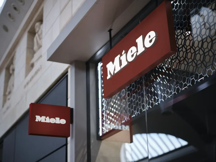 Miele logo signage on a authorized dealer shop window